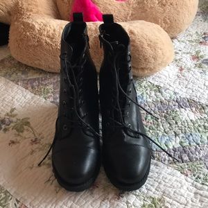 The cutest black boots with stars on the sides.